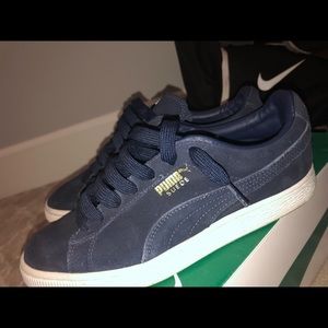 Navy blue puma suedes
